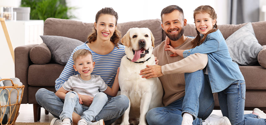 family with pet enjoying the best indoor air quality